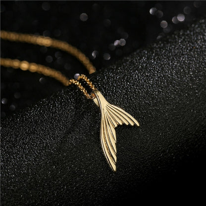 Gold Wolf Tooth Pendant Necklace with Devil's Eye Design